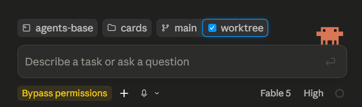 A screenshot of the Claude app's message composer, showing chips for the agents-base host, the cards project, and the main branch, plus a checked worktree checkbox.